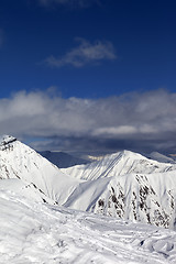 Image showing Ski slope and beautiful snowy mountains