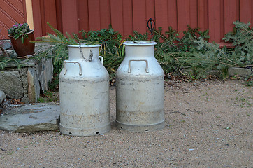 Image showing Old milk jug