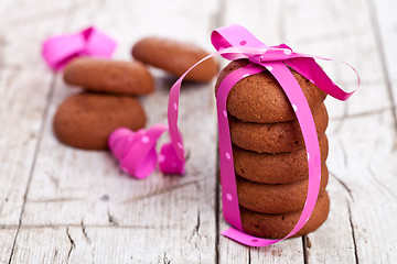 Image showing stack of chocolate cookies tied with pink ribbon