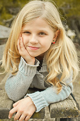 Image showing pretty girl on a bench 