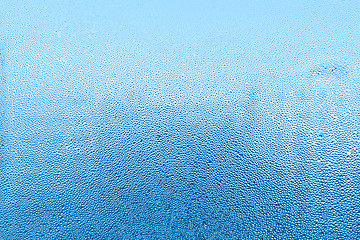 Image showing Natural water drops on glass