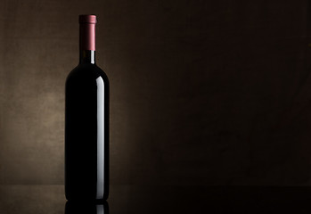 Image showing Black bottle of dry wine