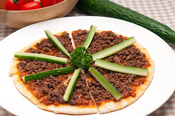 Image showing Turkish beef pizza with cucumber on top