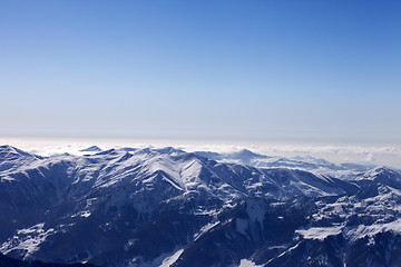 Image showing Snowy mountains in haze at morning