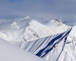 Image showing Ski slope and snowy mountains