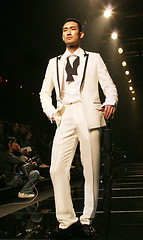 Image showing Asian male model on the catwalk during a fashion show - EDITORIA