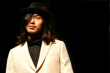 Image showing Asian male model on the catwalk during a fashion show - EDITORIA