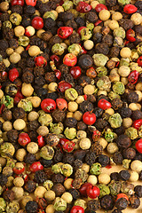 Image showing Four seasons pepper grains background
