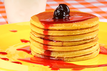 Image showing Pancakes with syrup and sour cherries