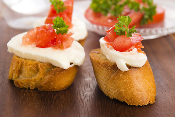 Image showing Bruschetta with mozarella and tomatoes