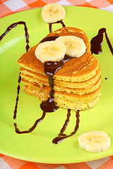 Image showing Heart shaped pancakes with chocolate sauce and banana