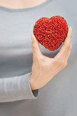 Image showing Holding heart