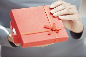 Image showing Opening gift