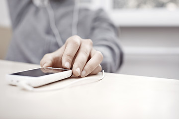 Image showing Smartphone with earphones