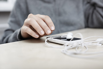 Image showing Smartphone with earphones