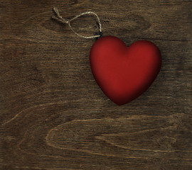Image showing red heart on dark wood