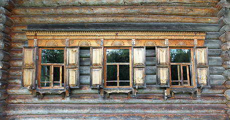 Image showing old russian wooden house with decorated windows