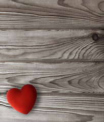 Image showing red heart on dark wooden planks