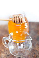 Image showing natural honey with a clean dipper 