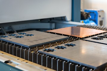 Image showing Machine cutting steel in a factory