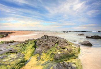 Image showing Wispy clouds and rocky tidal flows