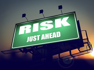 Image showing Risk Just Ahead on Green Billboard.