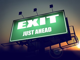 Image showing Exit Just Ahead on Green Billboard.