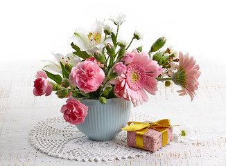 Image showing bouquet of flowers and gift box