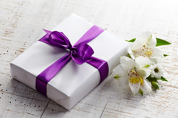 Image showing gift box and flowers