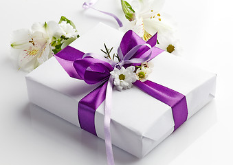 Image showing gift box and flowers