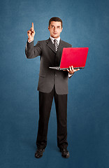 Image showing Business Man Shows Something With Finger