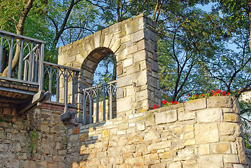 Image showing Medieval stone wall with flowers