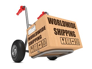 Image showing Worldwide Shipping - Cardboard Box on Hand Truck.