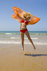 Image showing Girl runs on beach