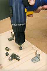 Image showing Fastening with an screwdriver furniture parts