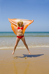 Image showing Girl runs on beach