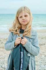 Image showing girl at the autumn beach 