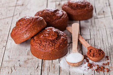 Image showing fresh baked browny cakes, sugar and cocoa powder