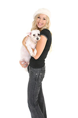 Image showing Woman holding a small dog