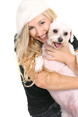 Image showing Happy girl cuddling dog