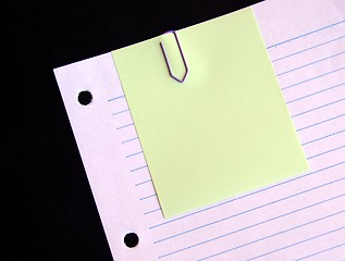 Image showing Clipped yellow paper on lined paper background