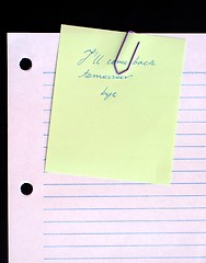 Image showing Clipped yellow paper on lined paper background