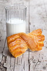 Image showing glass of milk and fresh baked bun