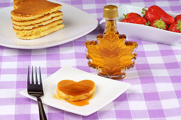 Image showing Mini heart-shaped pancake with syrup