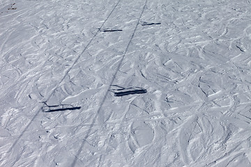 Image showing Shadows from chair lift on off-piste slope