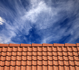 Image showing Roof tiles and sky with clouds at sun day