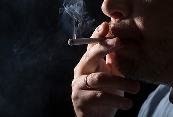 Image showing Portrait man smoking cigarette