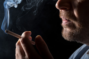 Image showing Portrait man smoking cigarette