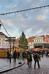 Image showing TALLINN, ESTONIA — DECEMBER 01: People enjoy Christmas market in Tallinn on December 01, 2013 in Tallinn , Estonia. It is Estonia oldest Christmas Market with a very long history dating back to 1441