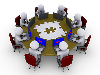 Image showing Businessmen around table searching for solution